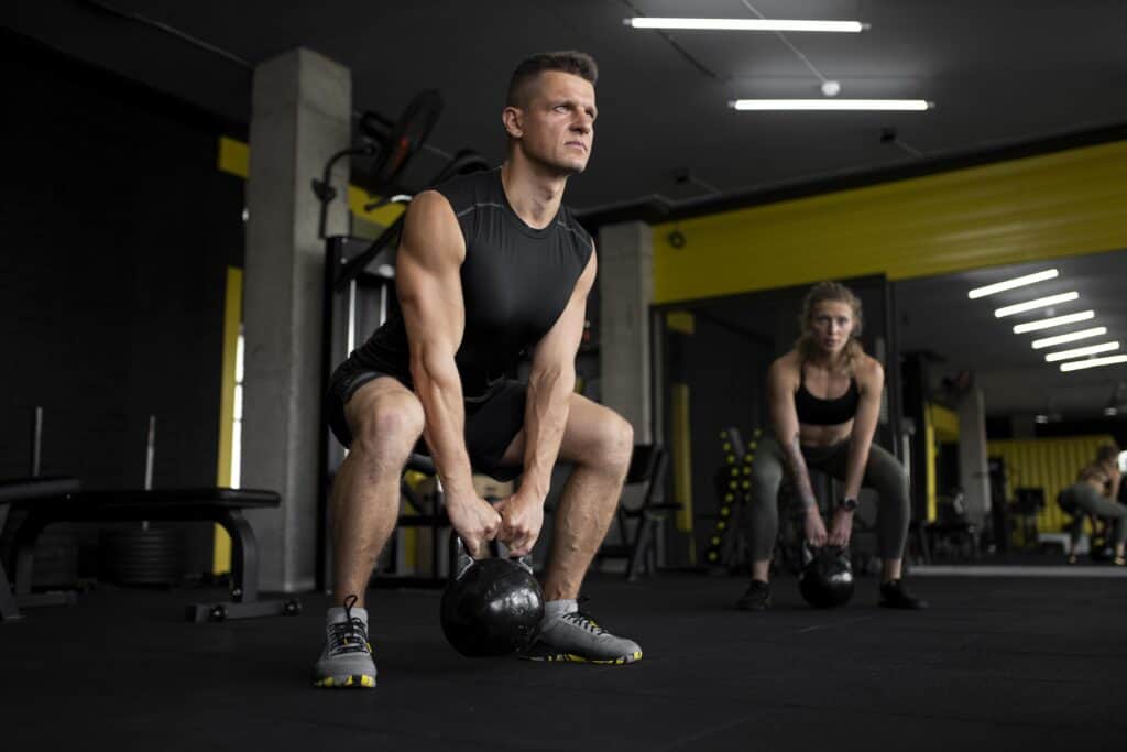 Man Performing a Kettlebell Squat