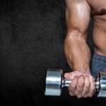 man performing dumbbell curl