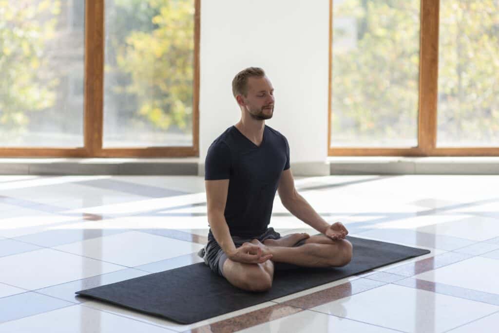 man doing yoga