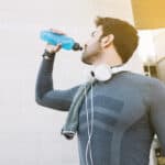 man drinking sports drink