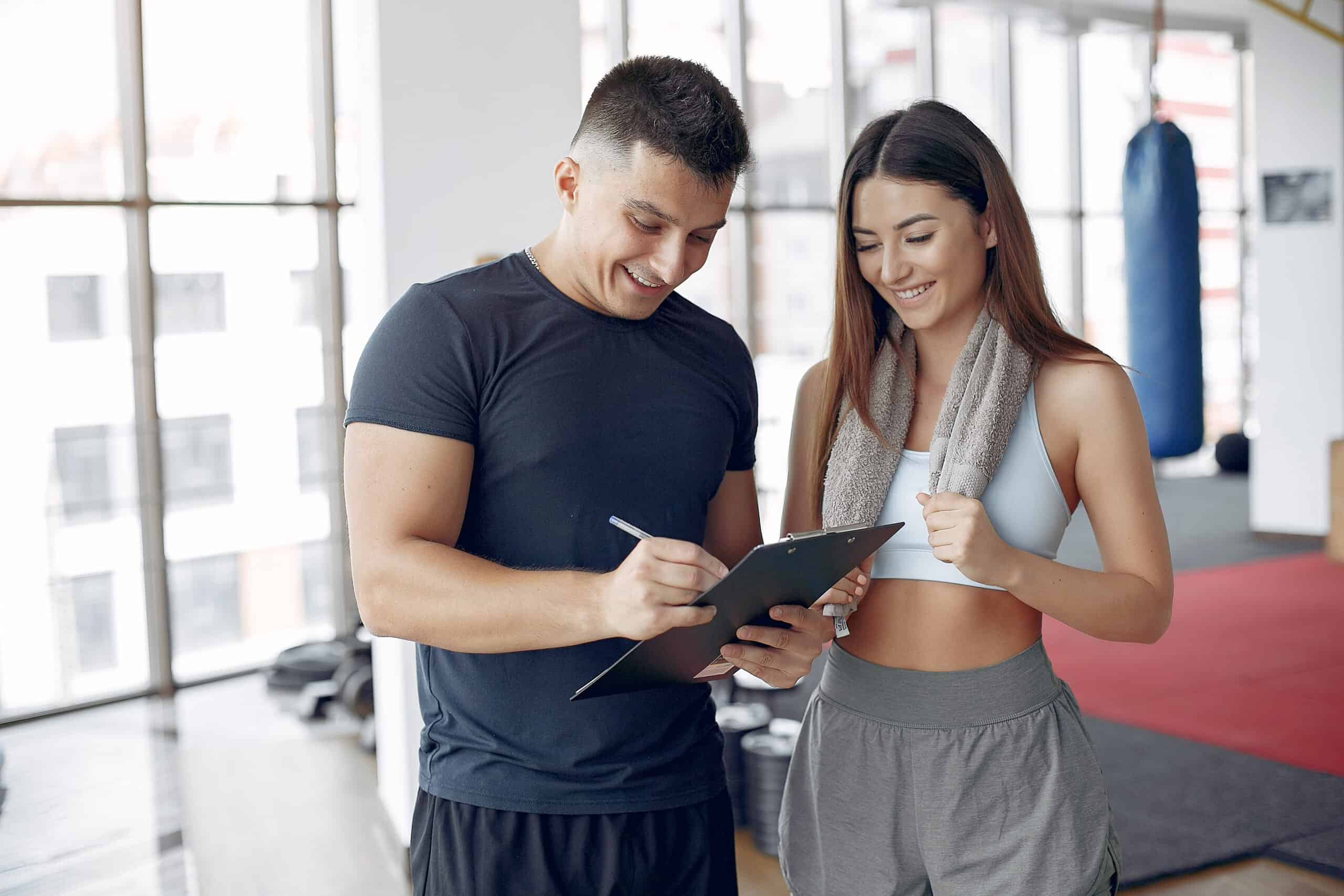 woman working with personal trainer