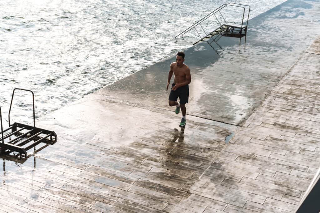 man jogging on a pier for cardio