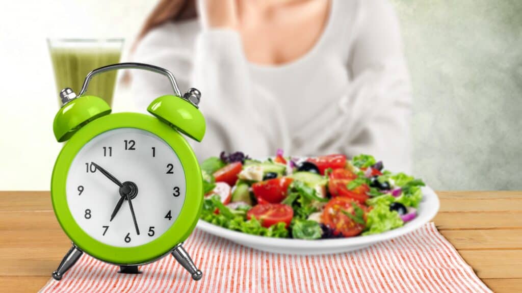 Clock next to healthy food