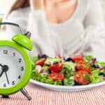 Clock next to healthy food