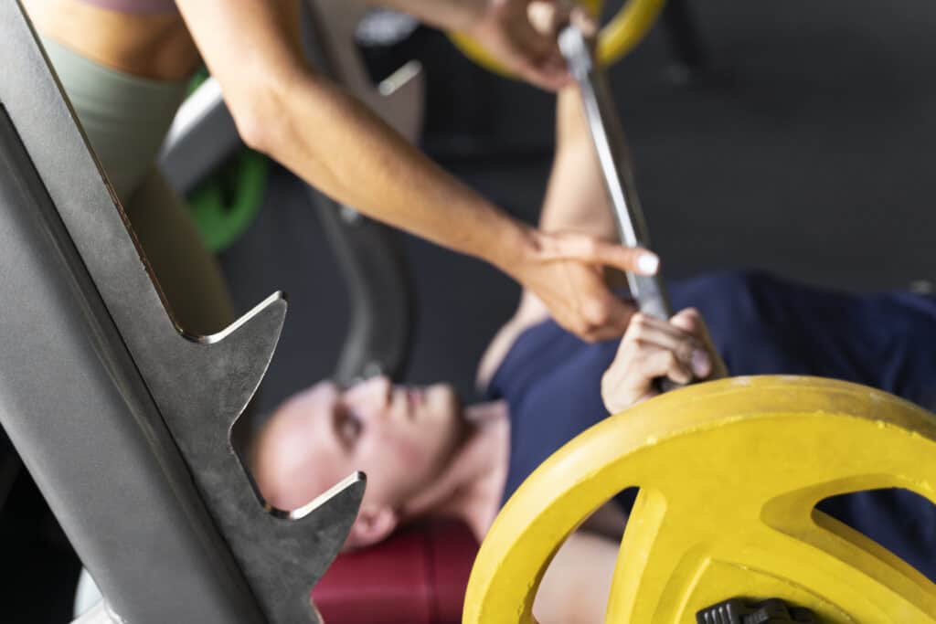 man doing bench press