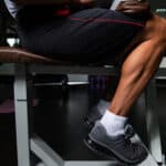 man working on calves at the gym