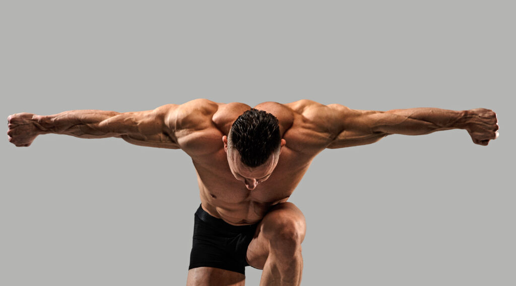 man posing to show muscle definition