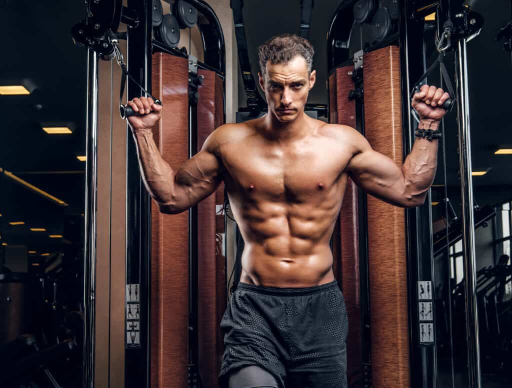 man working out with cable machine