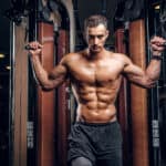 man working out with cable machine