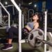 woman doing glute exercises with barbell