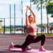 woman stretching at park