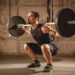 man doing barbell squat
