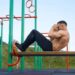 man doing crunches at outdoor gym