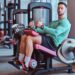man working out legs on gym machine