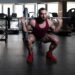 man doing barbell squat